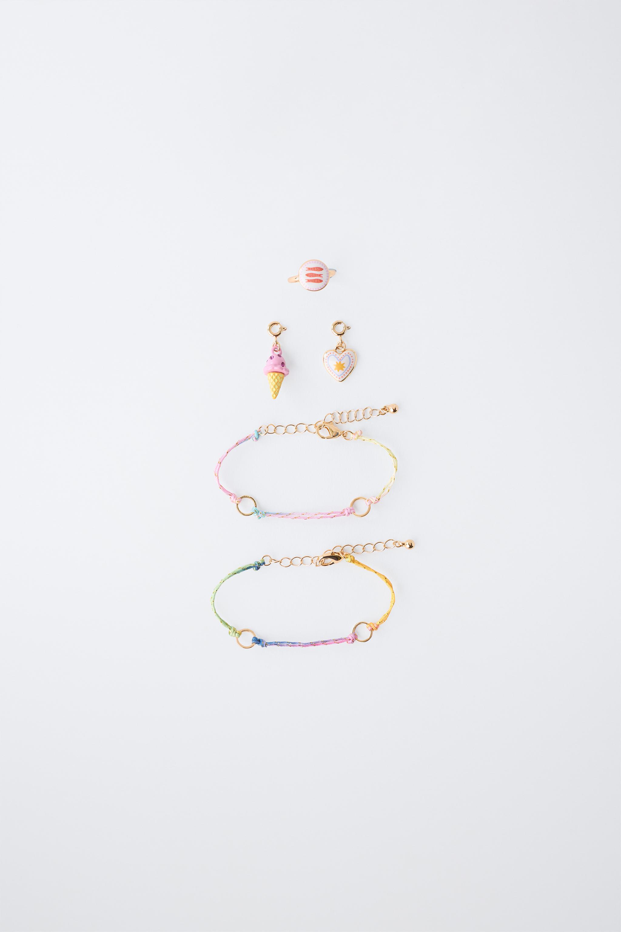 LOT DE DEUX BRACELETS À CHARMS INTERCHANGEABLES